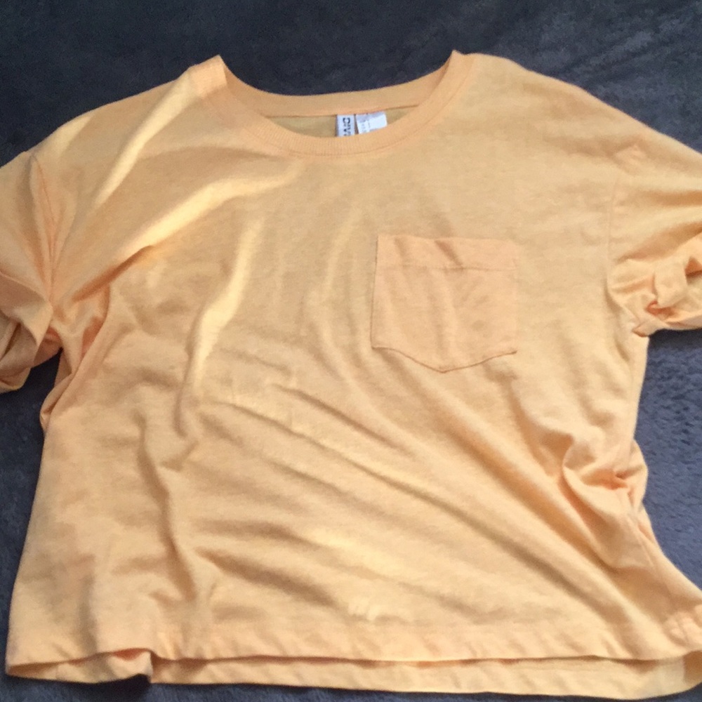 A orange cropped too shirt
